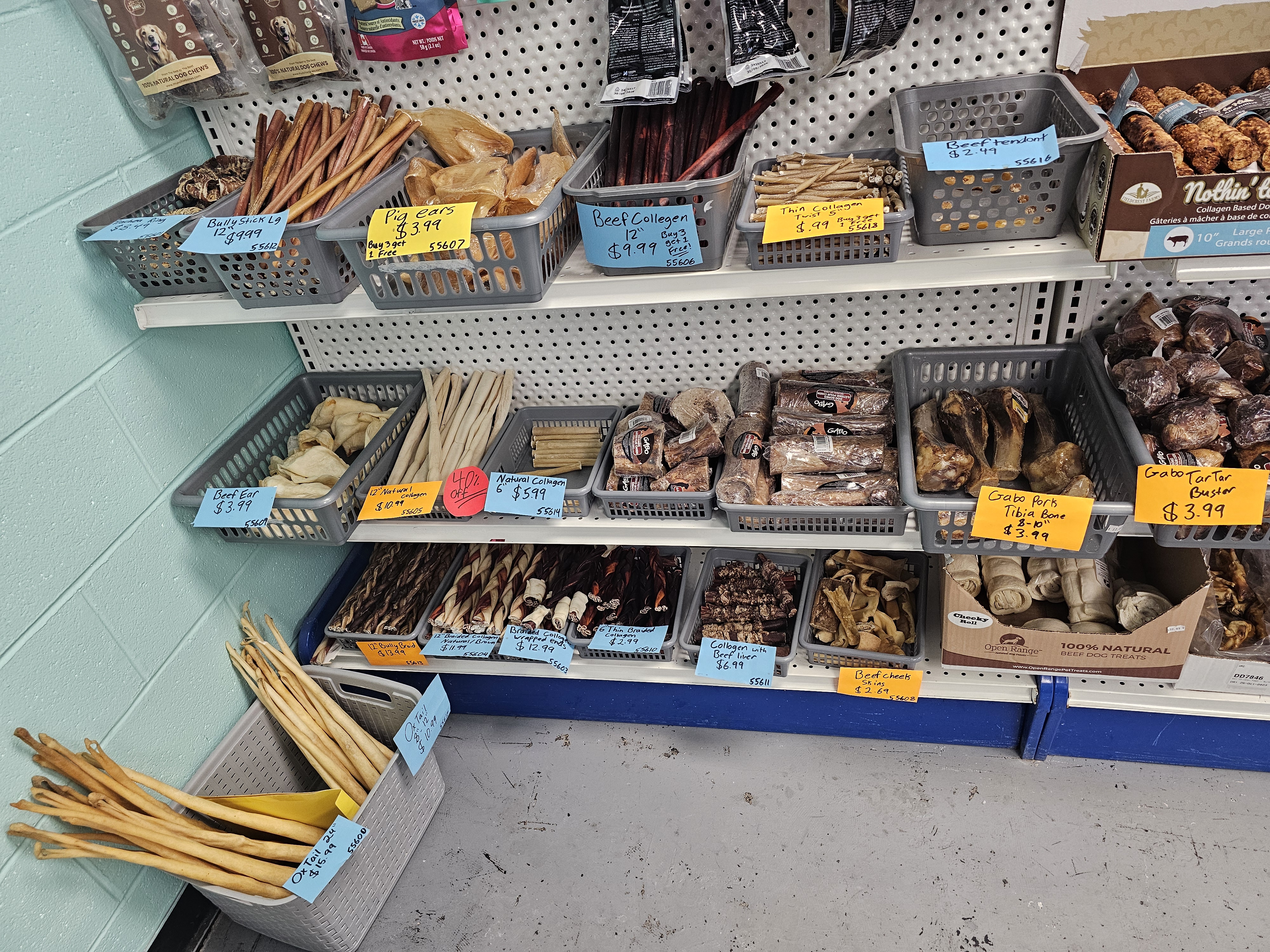 Assorted packaged dog treats on store display